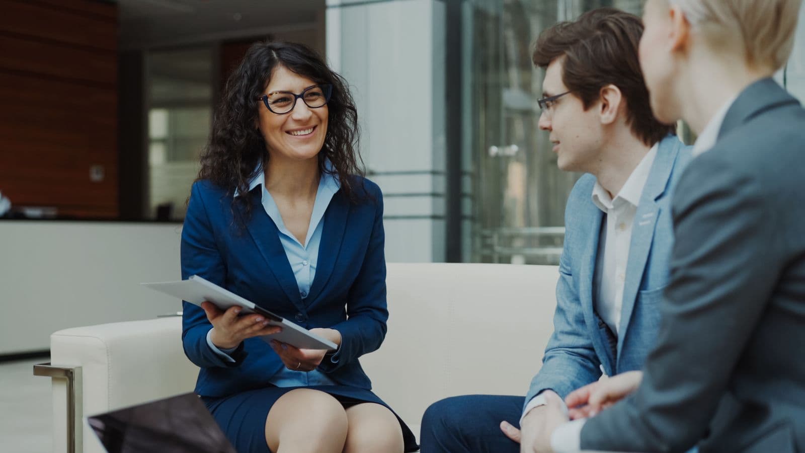 Business professionals discussing strategy in a modern office