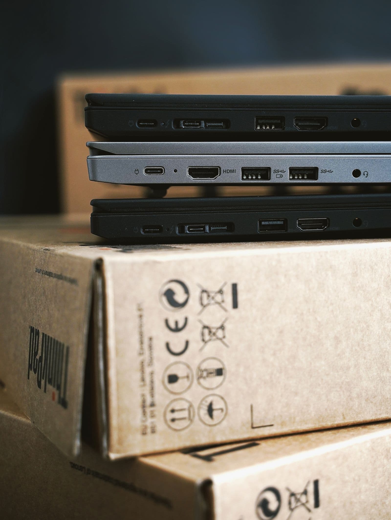 Stack of laptops on top of shipping boxes